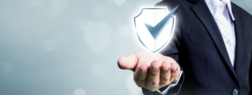 Businessman holding shield protect icon
