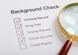magnifying glass over background check form