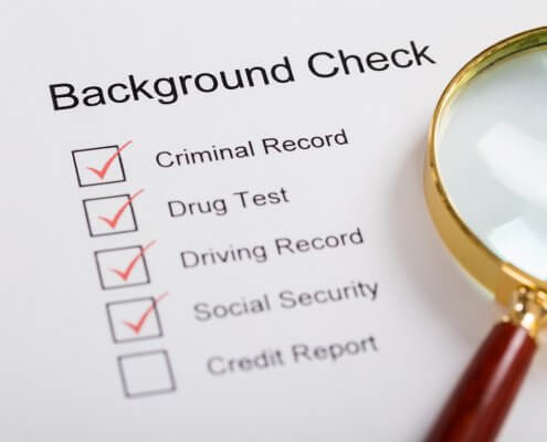 magnifying glass over background check form
