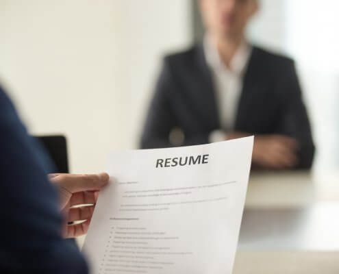 job interview in which applicant undergoes pre-employment screening