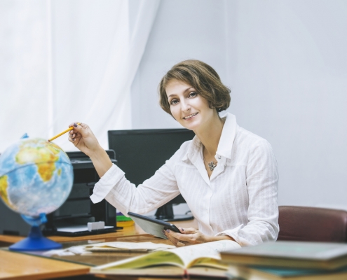 teacher in school at desk