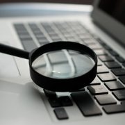 running a personal background check on laptop