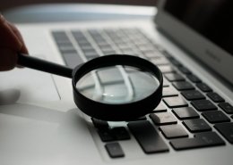 running a personal background check on laptop