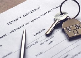 signing a tenancy agreement to receive keys to house
