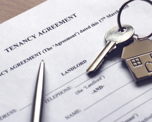 signing a tenancy agreement to receive keys to house