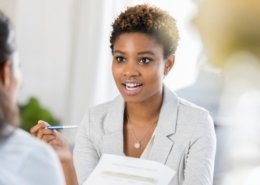 businesswoman discussing professional background checks with her customer
