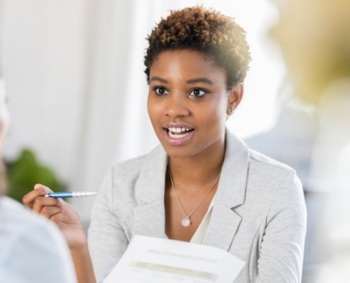 businesswoman discussing professional background checks with her customer