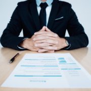 HR and resume of applicant undergoing background check and interview on table.