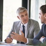 members of a background screening business discussing credit reports