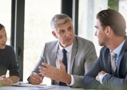 members of a background screening business discussing credit reports
