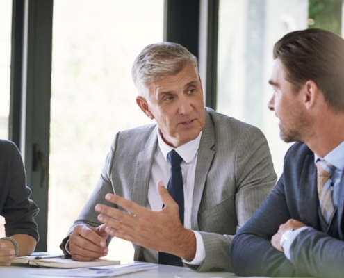 members of a background screening business discussing credit reports