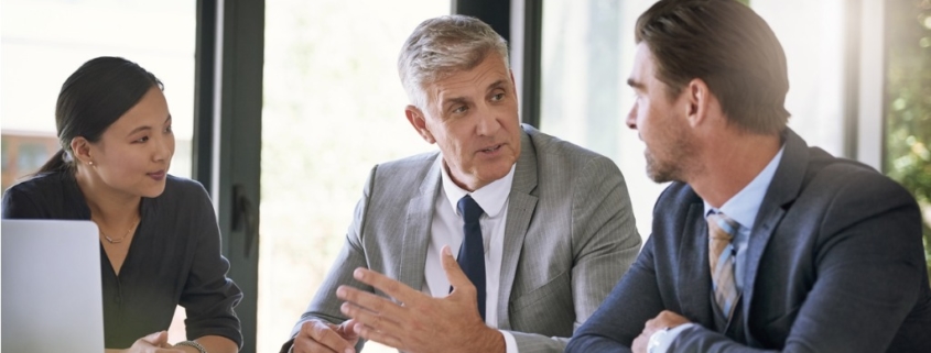 members of a background screening business discussing credit reports