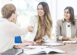 shaking hands at an interview. background check provider