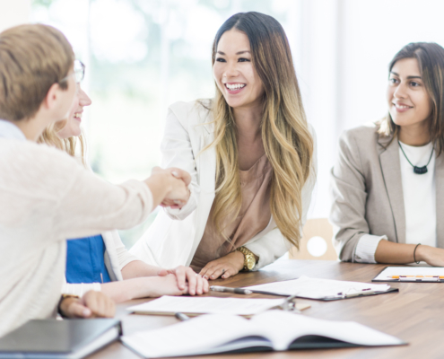 shaking hands at an interview. background check provider