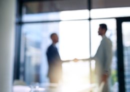 men shaking hands after background check verified past employee experiences