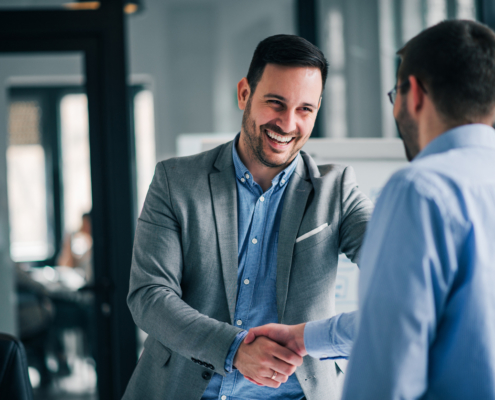 background check provider shaking hands at interview