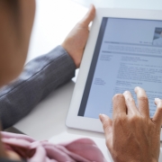 An HR representative using a tablet for an integrated background check.